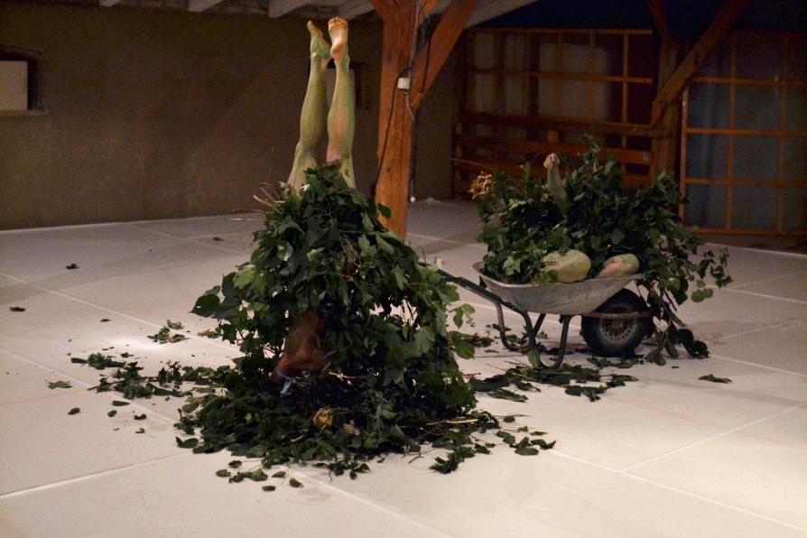 two tree-performers, inverted and decaying in studio